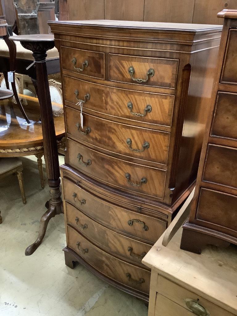 A reproduction George III style mahogany serpentine tallboy, width 72cm, depth 48cm, height 154cm